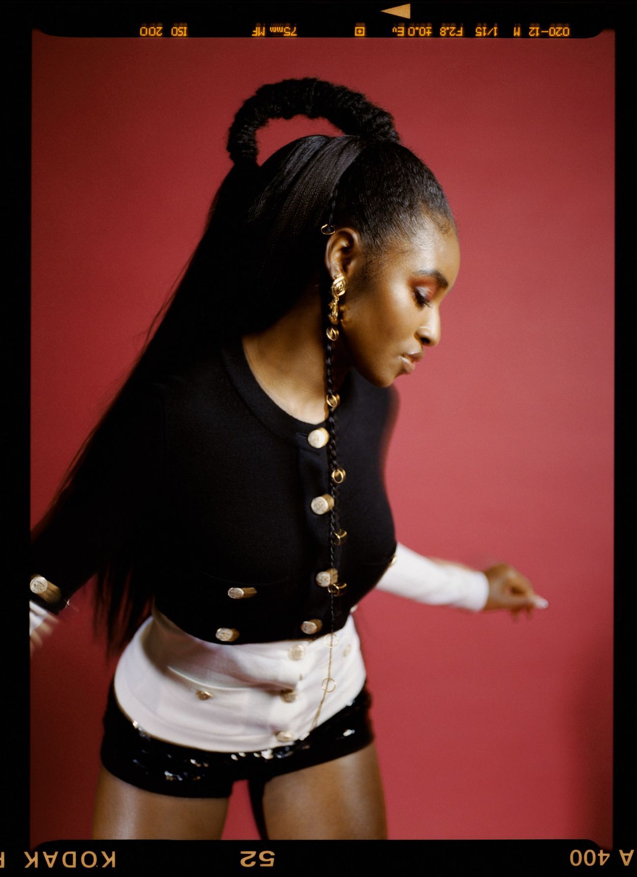 Jayme Lawson wears a Chanel top, shorts and earrings. Hair by Cheryl Bergamy for Exclusive Artists using Contents Hair Care. Makeup by Jessica Smalls for The Wall Group.